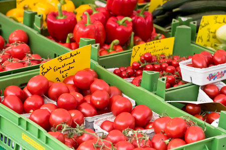 GERMANY, NUREMBERG - MAY 21: Natural organic tomatoes in boxes on farmer's market on May 21, 2015のeditorial素材