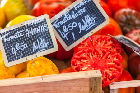 FRANCE, LYON - AUGUST 07: Natural organic tomatoes in boxes on farmer's market on August 07, 2014のeditorial素材