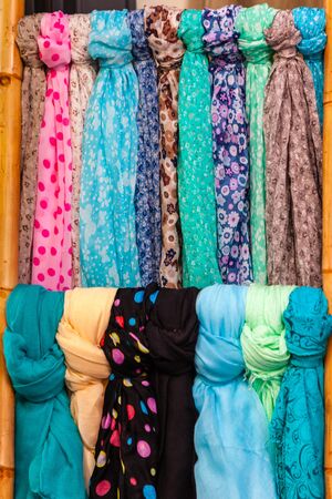 Selection of colorful women scarves at a marketの写真素材