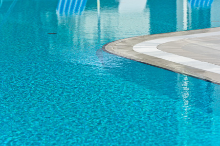 Clear blue bright water in the swimming pool