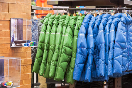 GERMANY, LEIPZIG - DECEMBER 18: Bright winter clothes hanging at a fashion store on December 18, 2012のeditorial素材