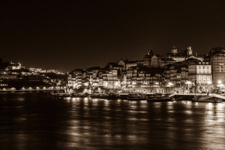 PORTUGAL, PORTO - JANUARY 20: Overview of Old Town of Porto, Portugal at night. Ribeira and Douro river on January 20, 2013のeditorial素材