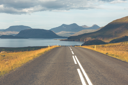 Endless Highway through Icelandic landscape. Seaside roadの写真素材
