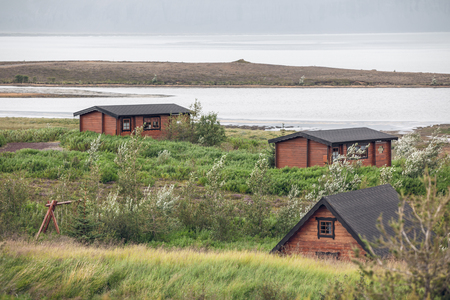 Overgrown Small Houses in Icelandの写真素材