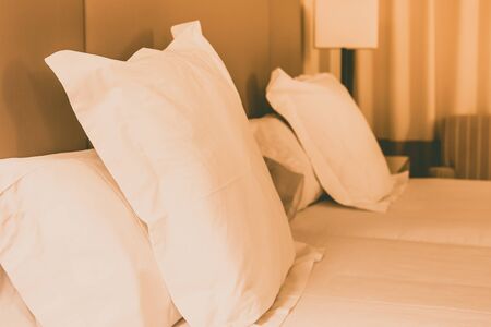 Prepared fresh bed, scene in hotel room. Horizontal filtered shotの写真素材