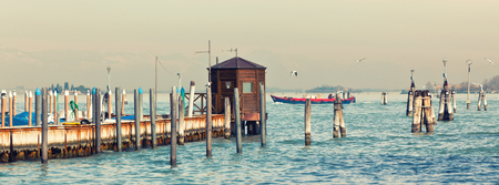 Old sea pier in Venice. Long wide toned bannerの写真素材