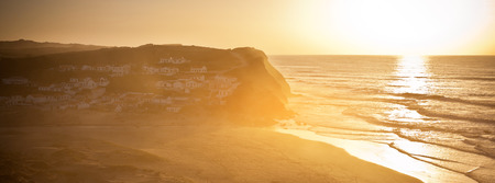 Beautiful orange sunset on the Portugal ocean coast. Horizontal shotの写真素材