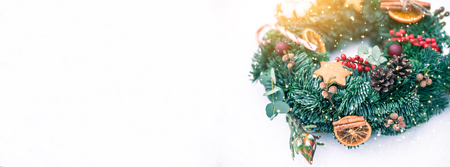 Christmas wreath isolated on a white snow background. Long wide banner with Copy spaceの写真素材