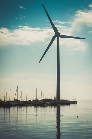 Rural water landscape with working wind turbines. Netherlandsの写真素材