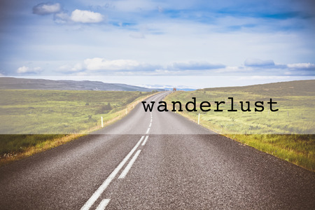 Inspirational typographic quote wanderlust. Travel vacations tourism adventure road trip conceptの写真素材