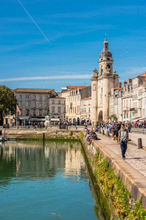 FRANCE, LA ROCHELLE - SEPTEMBER 21, 2015: View of people on the promenade in the old port of La Rochelle Franceのeditorial素材