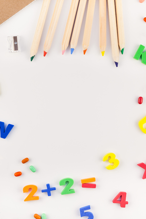 Creative flat lay back to school concept with color school and office supplies on white table backgroundの写真素材