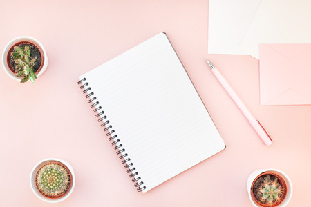 Top view flat lay of workspace desk styled design office supplies and cactuses succulents with copy...