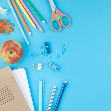 Square Creative flat lay top view back to school concept with color school and office supplies on bright turquoise paper table frame background with copy space, template for text or designの写真素材