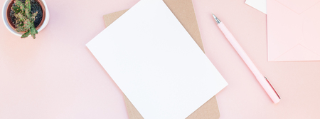 Long wide banner of workspace desk styled design office supplies and cactuses succulents with copy space millennial pink color paper background minimal style. Template for feminine blog social mediaの写真素材