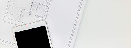 Creative flat lay long wide banner top view blueprints architectural flat project plan office supplies decorator white table workspace with swatches tools and equipment background copy space conceptの写真素材