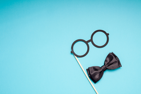 Creative flatlay overhead top view retro stylish black paper photo booth props moustaches turquoise background copy space. Men health awareness month fathers day masculinity concept blog social mediaの写真素材