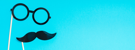 Creative long wide banner top view retro stylish black paper photo booth props moustaches turquoise...