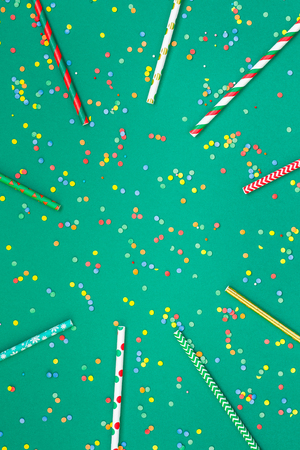 New Year and Christmas pattern straws on sparkles backgroundの写真素材