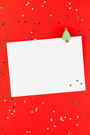 Creative New Year or Christmas greetings letter mockup flat lay top view Xmas holiday celebration envelope on red paper background golden glitter. Template mock up greeting card text design 2019 2020の写真素材