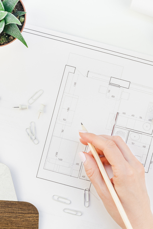 Creative flat lay overhead top view blueprints architectural flat project plan and office supplies...