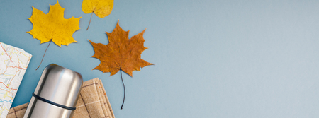 Creative Top view flat lay outdoors trip composition map retro camera cutlery blanket grey blue background copy space. Template weekend outing picnic nature tourism recreation Long wide bannerの写真素材