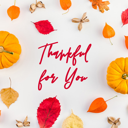 Creative Top view flat lay autumn composition. Pumpkins dried orange flowers leaves background copy space. Square Template frame fall harvest thanksgiving halloween anniversary invitation cardsの写真素材