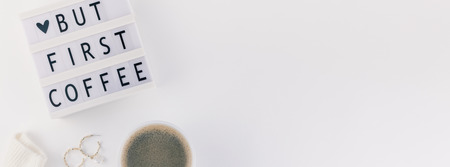 Creative autumn flat lay overhead top view coffee cup vintage lightbox But coffee first text sweater white background copy space minimal style Fall winter season blog template Long wide bannerの写真素材