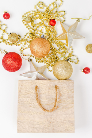 New Year or Christmas composition flat lay top view Xmas holiday celebration decorative toy balls sparkles isolated white paper background copy space Template frame for greeting card your text designの写真素材