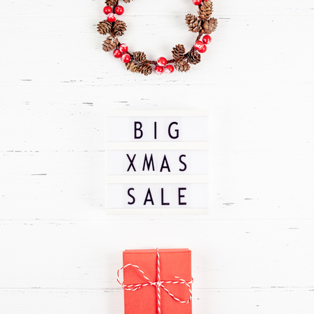 Creative Top view flat lay promotion composition Big Xmas sale text lightbox white wooden background copy space Template seasonal winter christmas offer promotion advertising scandinavian minimalismの写真素材