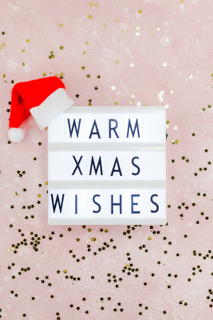 New Year or Christmas composition flat lay top view Xmas holiday celebration handmade handicraft wooden garland with text pink background copy space Template for greeting card text designの写真素材