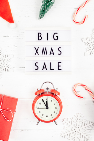 Creative Top view flat lay promotion composition Big Xmas sale text lightbox white wooden background copy space Template seasonal winter christmas offer promotion advertising scandinavian minimalismの写真素材