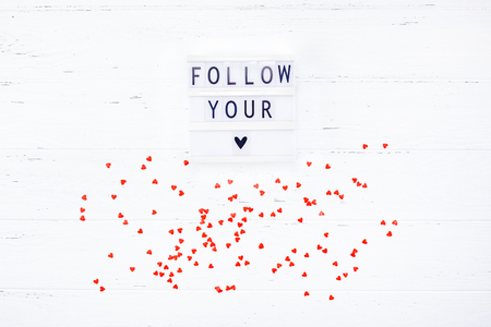 Creative Valentine Day romantic composition flat lay top view love holiday celebration with red heart lightbox white wooden background copy space Template greeting card text design social media blogsの写真素材