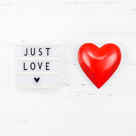 Creative Valentine Day romantic composition flat lay top view love holiday celebration with red heart lightbox white wooden background copy space Template greeting card text design social media blogsの写真素材