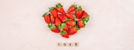 Creative Valentine Day romantic concept composition flat lay top view love holiday celebration with red heart strawberries pink background copy space Template greeting card text social media blogsの写真素材