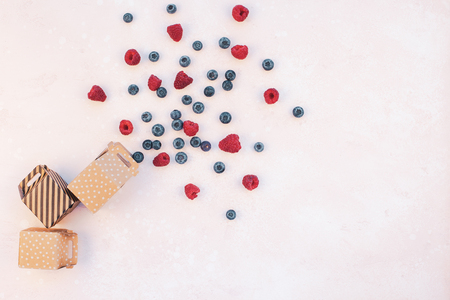 Creative Shopping promo sale concept composition flat lay top view gift box raspberry blueberry pink background copy space Template greeting card text social media blogsの写真素材