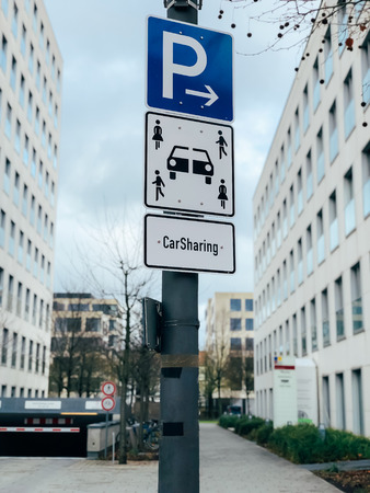 Carsharing vehicle parking sign in Munich, Germany, Europe. Modern rental ideology transport concept. Mobile photoの写真素材