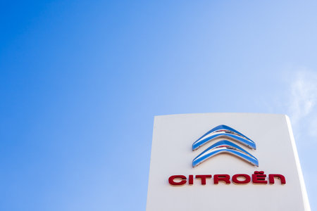 SAGUNTO, SPAIN - FEBRUARY 18, 2019: Citroen brand logo on clear blue sky background located in...
