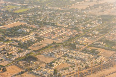 Dubai residential districts golden sunrise morning scene. Top view from aboveの写真素材