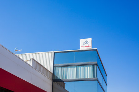 SAGUNTO, SPAIN - FEBRUARY 18, 2019: Citroen brand logo on clear blue sky background located in Sagunto, Spainのeditorial素材