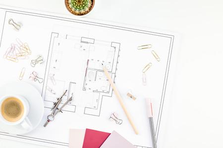 Creative flat lay overhead top view blueprint flat project plan hot coffee cup and office supplies...