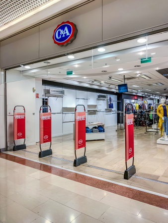 LYON, FRANCE - FEBRUARY 26, 2019: C&A store of international chain of mass fashion retail clothing stores brand logo at its building located in Lyon shopping mall France. Mobile photoのeditorial素材