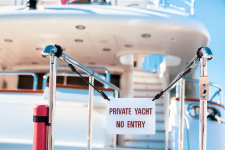 Bridge of private luxury ship with prohibited entry sign Private yacht No entry in Marina of Cannes,...