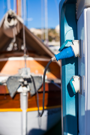 Moored yachts charching with fuel and electricity in Marina of Cannes, Franceの写真素材