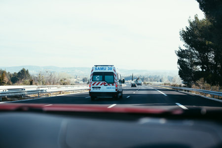 BEZIERS, FRANCE - FEBRUARY 26, 2018: ambulance van driving along highway.のeditorial素材