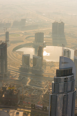 DUBAI, UAE - JANUARY 02, 2015: Dubai downtown sunrise morning scene. Top view from aboveのeditorial素材