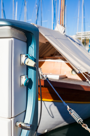 Moored yachts charching with fuel and electricity in Marina of Cannes, Franceの写真素材