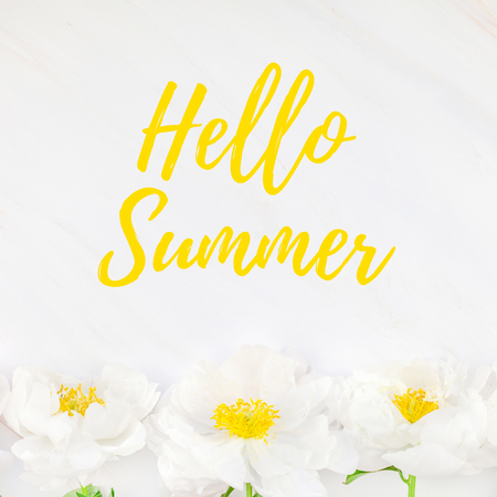 Beautiful blooming white peony flowers on marble background with Hello Summer welcoming text, square template for postcard. Summer celebration greeting conceptの写真素材