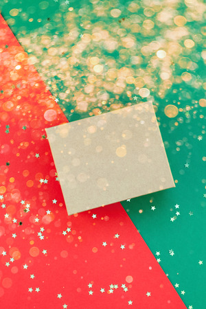 New Year or Christmas presents preparation DIY flat lay top view Xmas holiday celebration handmade gift boxes on red green paper background. Template mockup for greeting card or your text design 2020の写真素材