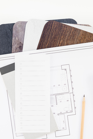 Creative flat lay overhead top view blueprint flat project plan and office supplies on decorator table workspace swatches tools and equipment background copy space conceptの写真素材